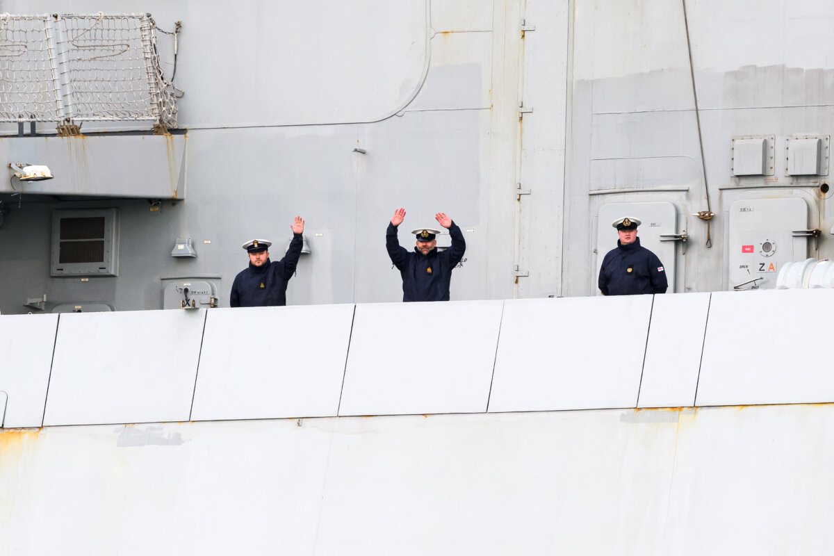Crew members wave goodbye to family and friends as HMS Dragon sets sail from Portsmouth Harbour, in Portsmouth, England, on March 10, 2026. (Leon Neal/Getty Images)