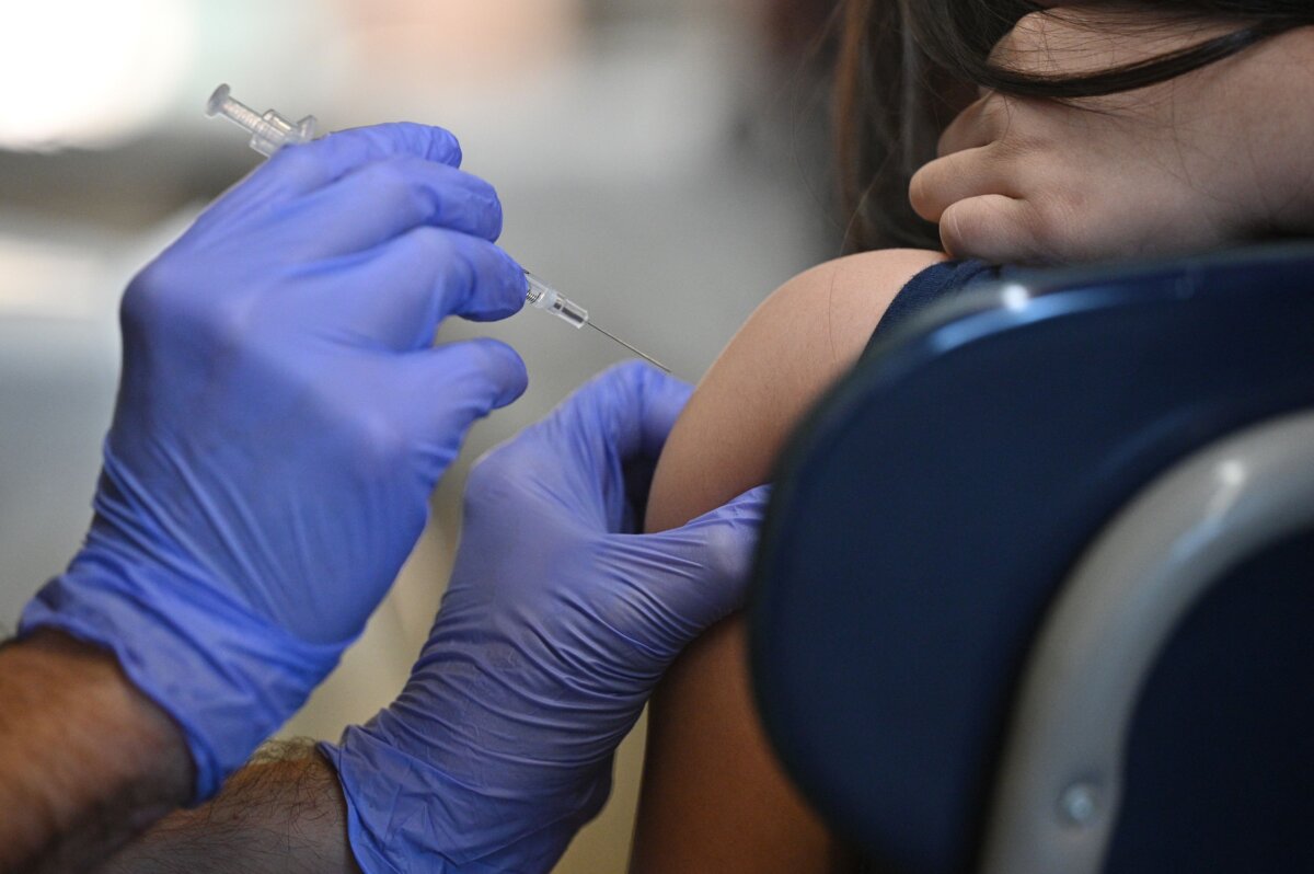 A person receives a vaccine in Los Angeles in a file photograph. (Robyn Beck/AFP via Getty Images)