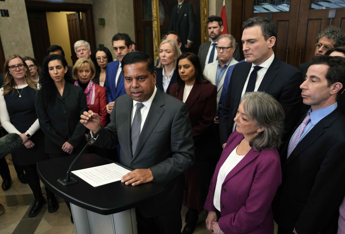 Minister of Public Safety Gary Anandasangaree is surrounded by members of the Liberal caucus speaks at a news conference on the Canada Community Security Program in the foyer of the House of Commons on Parliament Hill in Ottawa, on March 11, 2026. (The Canadian Press/Justin Tang)