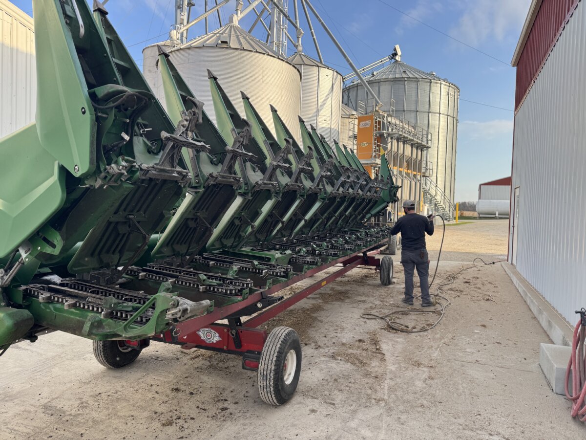 A farmer conducts air-cleaning of one of the large corn heads at Carnahan & Sons family farm in Knox County, Ind. (Courtesy of Dennis Carnahan)