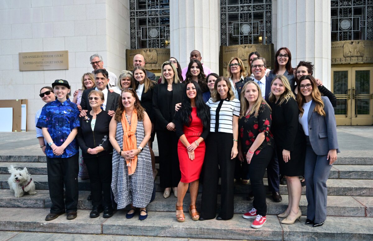 Survivor parents, family members, and lawyers gather outside Los Angeles Superior Court on March 12, 2026, as a trial examines whether social media companies deliberately designed their platforms to be addictive to children. (Frederic J. Brown/AFP via Getty Images)