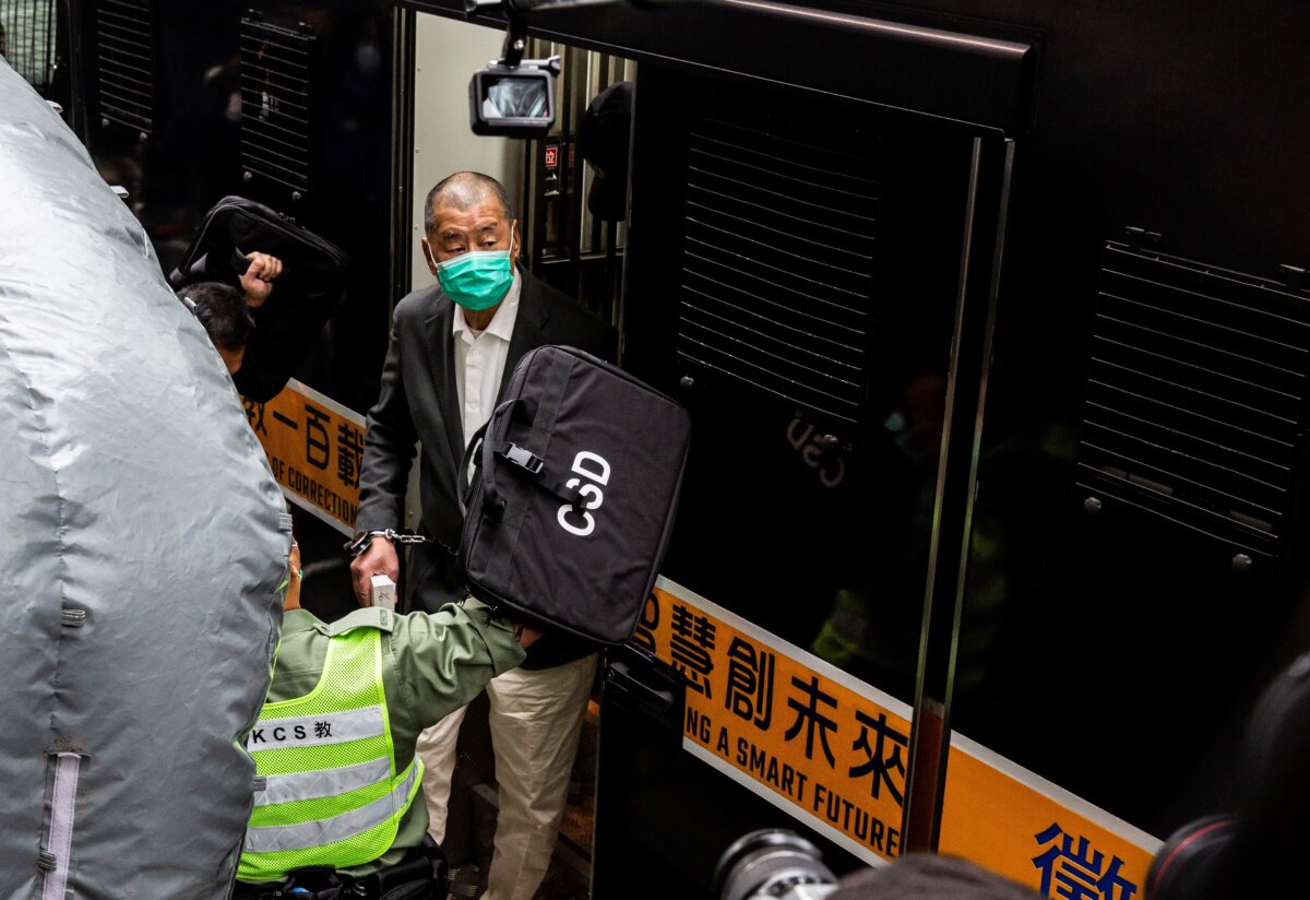 Hong Kong pro-democracy media tycoon Jimmy Lai (C) arrives at the Court of Final Appeal to hear a decision on whether he will be granted bail in Hong Kong on Feb. 9, 2021. (Isaac Lawrence/AFP via Getty Images)