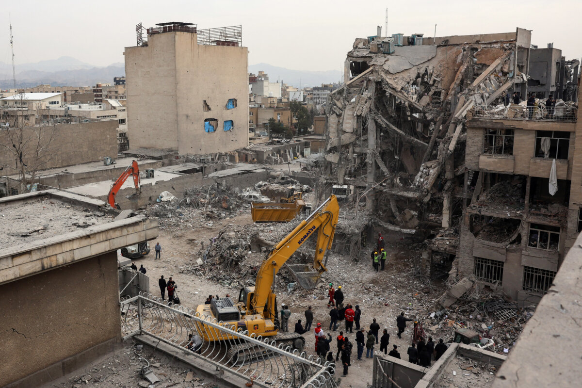 Rescue workers search the rubble of a destroyed residential building in Tehran, Iran, on March 12, 2026. (AFP via Getty Images)