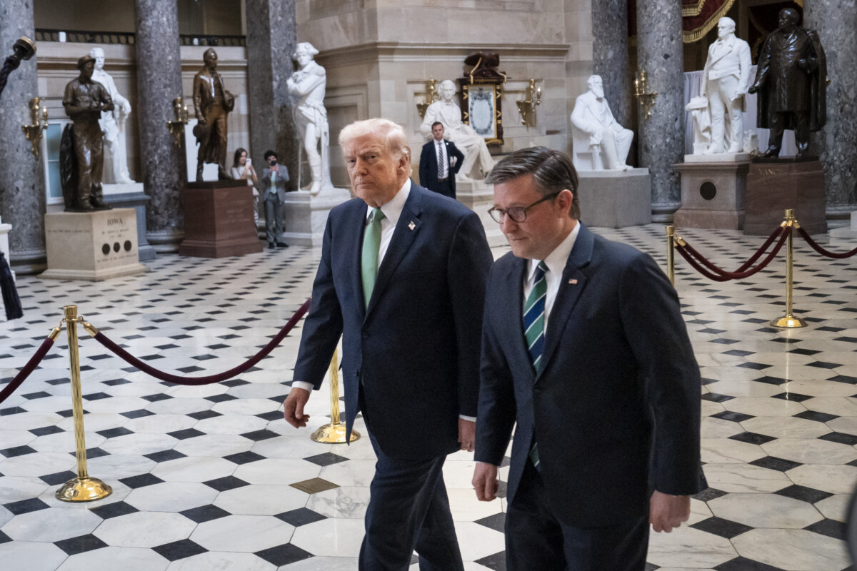 President Donald Trump and House Speaker Mike Johnson walk in the U.S. Capitol building in Washington on March 17, 2026. (Madalina Kilroy/The Epoch Times)