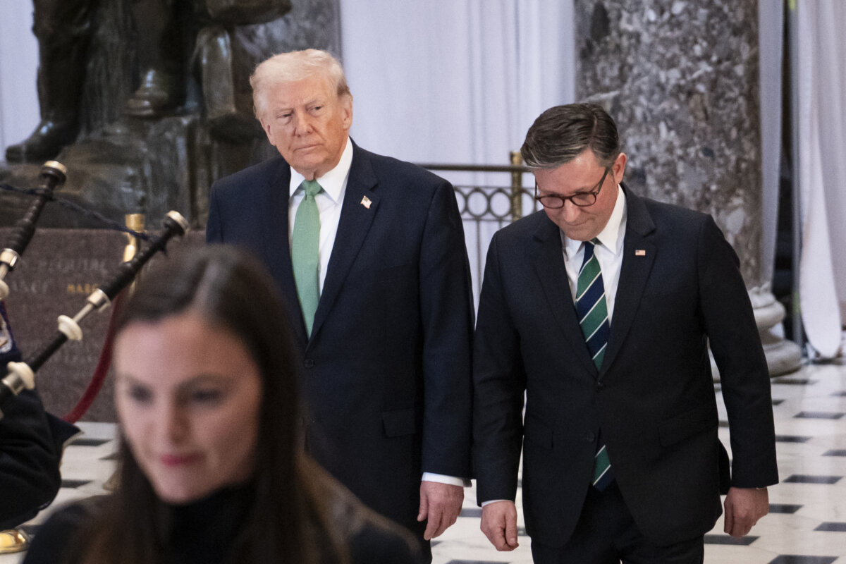 President Donald Trump and House Speaker Mike Johnson walk in the U.S. Capitol building in Washington on March 17, 2026. (Madalina Kilroy/The Epoch Times)