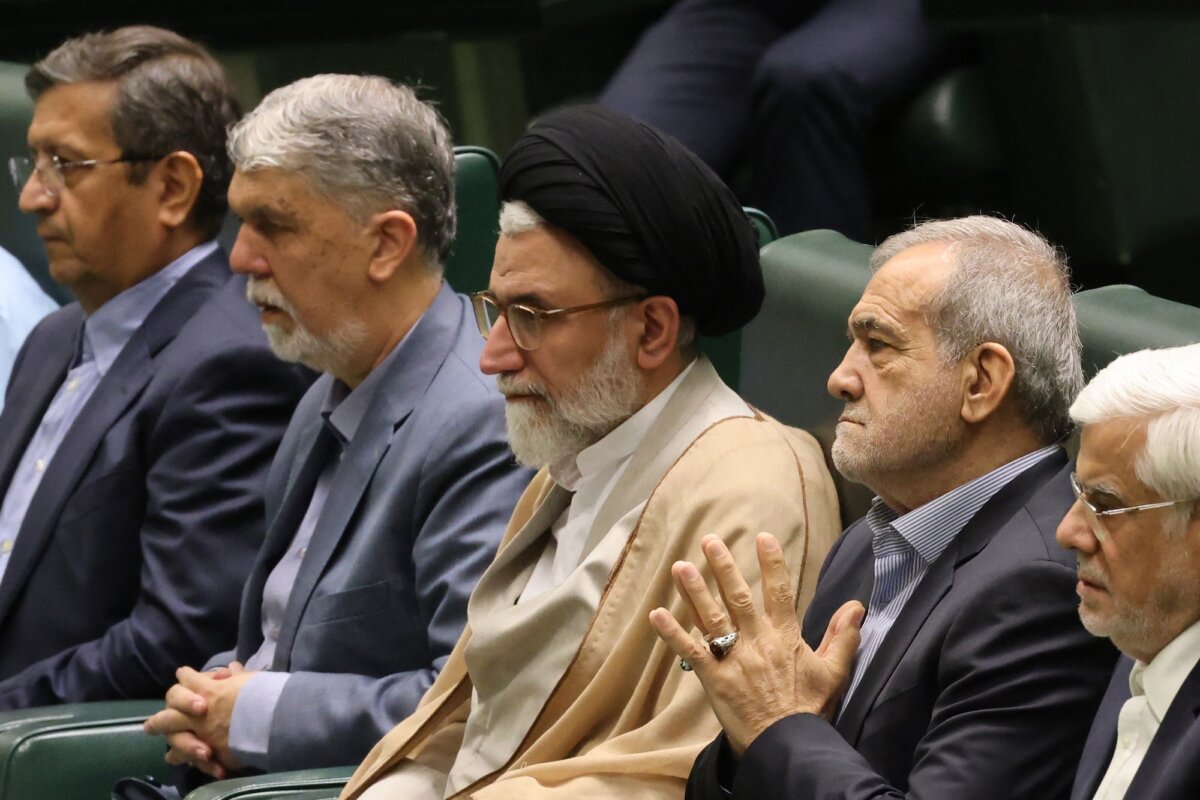 Iranian Minister of Intelligence Esmail Khatib (C) sits with Iranian President Masoud Pezeshkian (2nd R) before a speech to members of parliament, in Tehran, Iran, on Aug. 17, 2024. (Atta Kenare/AFP/Getty Images)
