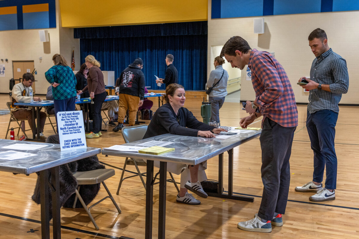 Election officials assist voters in casting their ballot in the primary vote at Bruns Avenue Elementary School, Mecklenburg County Precinct 12, in Charlotte, N.C. , on March 3, 2026. (Grant Baldwin/Getty Images)