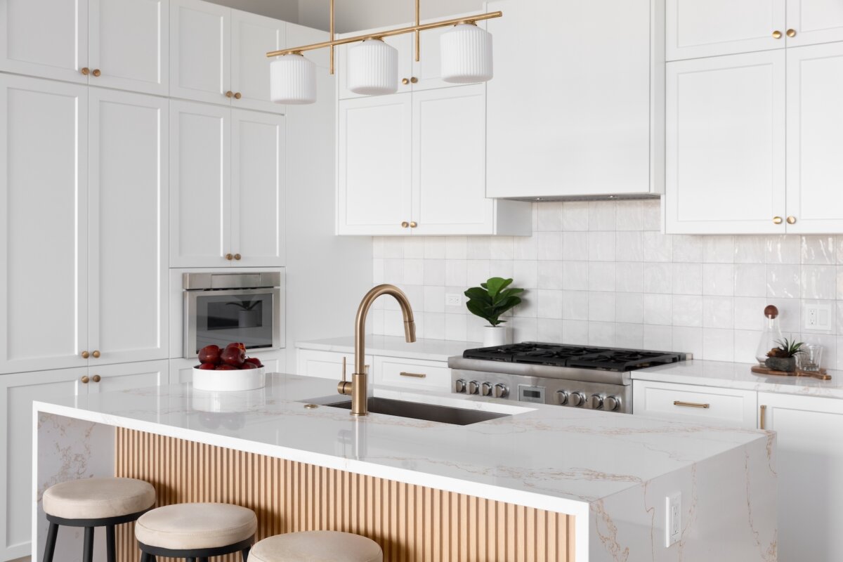 You will gain storage area in drawers and cabinets below the island in addition to the additional countertop space. You may consider installing a two-element electric cooktop in the countertop that takes up little space. (Joseph Hendrickson/Shutterstock)
