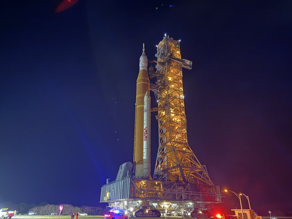NASA’s moon rocket, the Artemis II Space Launch System, rolls out to its launch pad at Kennedy Space Center, Florida, in the early morning hours of March 20, 2026. (T.J. Muscaro/The Epoch Times)