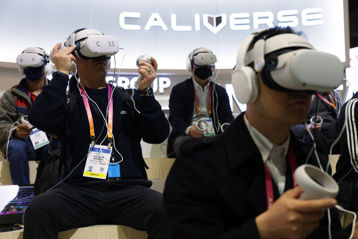Attendees try out the Caliverse Hyper-Realistic Metaverse experience at the Lotte booth at Consumer Electronics Show 2023 at the Las Vegas Convention Center in Las Vegas on Jan. 5, 2023. (Alex Wong/Getty Images)