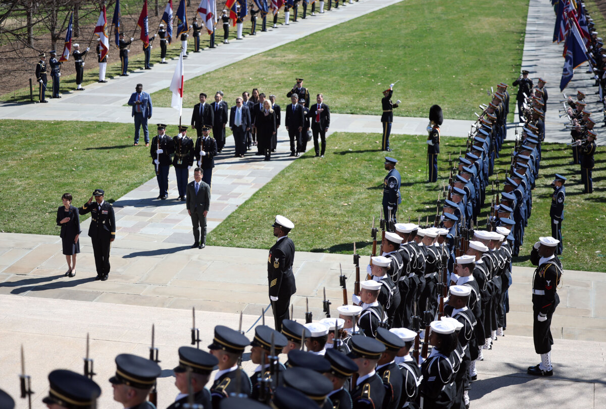 During an official visit to the United States, Prime Minister of Japan Sanae Takaichi is joined by Army Maj. Gen. Antoinette Gant as they stand for the U.S. and Japan national anthems before she lays a wreath at the Tomb of the Unknown Soldier at Arlington National Cemetery in Arlington, Va., on March 20, 2026. (Kevin Dietsch/Getty Images)