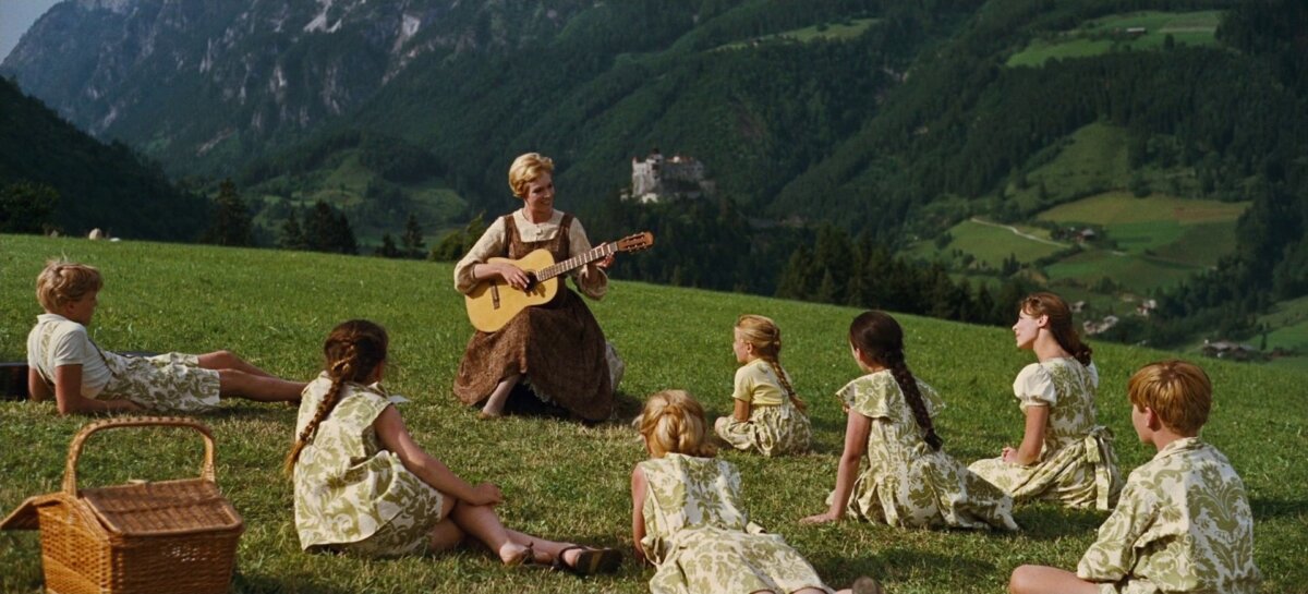 Maria (Julie Andrews) sings to the children on the mountain, in "The South of Music." (Twentieth Century Fox)