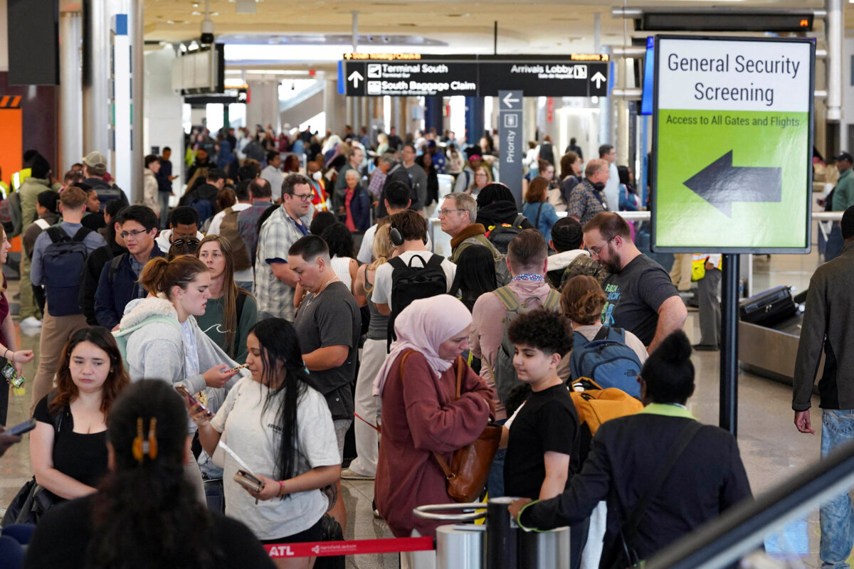 Passengers wait in long Transportation Security Administration lines as a partial government shutdown continues, at Hartsfield-Jackson Atlanta International Airport in Atlanta on March 20, 2026. (Megan Varner/Reuters)