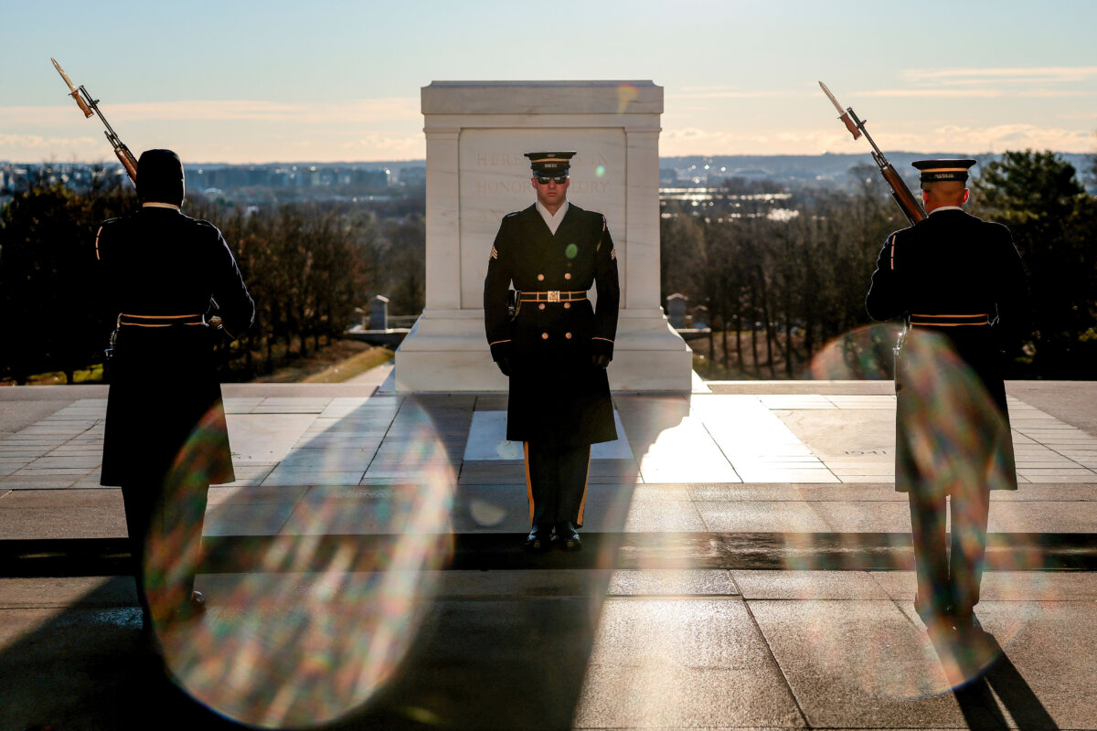 The ceremonial changing of the guards at the Tomb of the Unknown Soldier takes place as the sun rises over Arlington National Cemetery in Arlington, Va., on March 17, 2026. March 25 will mark the centennial of the continuous military sentinel guarding the Tomb of the Unknown Soldier. (Heather Diehl/Getty Images)