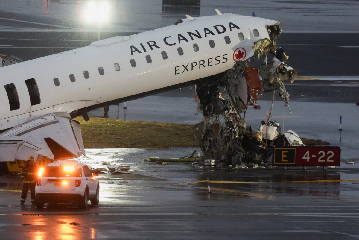Debris hangs from a damaged Air Canada Express jet that had collided with a ground vehicle at New York's LaGuardia Airport in Queens, New York, March 23, 2026. (Reuters/Shannon Stapleton)