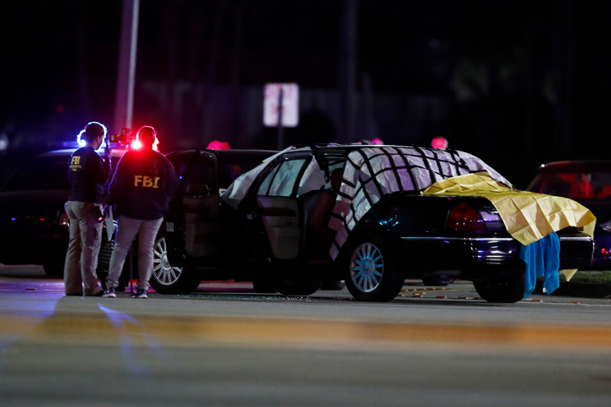 Authorities investigate the scene of a fatal shooting Dec. 5, 2019, in Miramar, Fla. (Brynn Anderson/AP Photo)