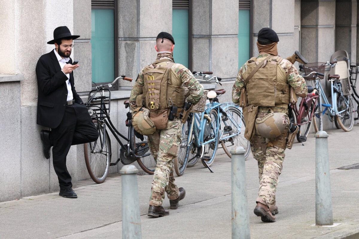 Belgian army personnel patrol a street as part of a deployment of soldiers outside Jewish institutions in Antwerp and Brussels following attacks at Jewish sites in Belgium and other European countries, in Antwerp, Belgium, on March 23, 2026. (Yves Herman/Reuters)