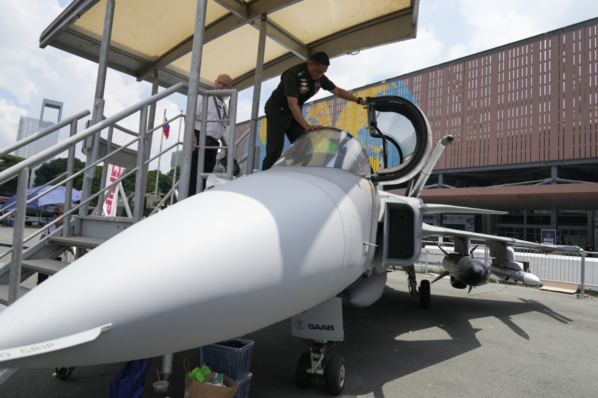 File photo — Philippine military chief Gen. Romeo Brawner Jr. prepares to board the cockpit of a replica of the Saab Gripen combat aircraft during the Asian Defense and Security Exhibition on Sept. 25, 2024, in Manila, Philippines. (AP Photo/Aaron Favila)