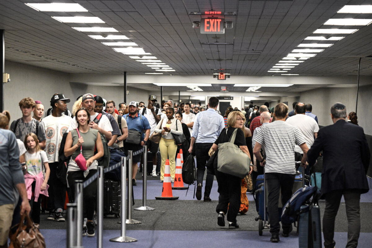Travelers wait in long security lines at George Bush Intercontinental Airport in Houston, Texas, on March 23, 2026. (Ronaldo Schmidt/AFP via Getty Images)
