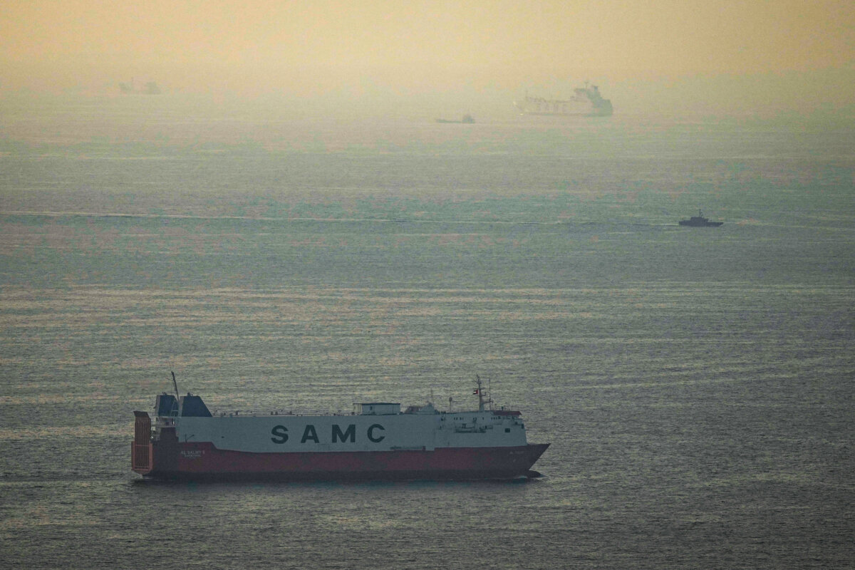 Cargo ships sail in the Arabian Gulf toward the Strait of Hormuz near the United Arab Emirates on March 19, 2026. (AP Photo)