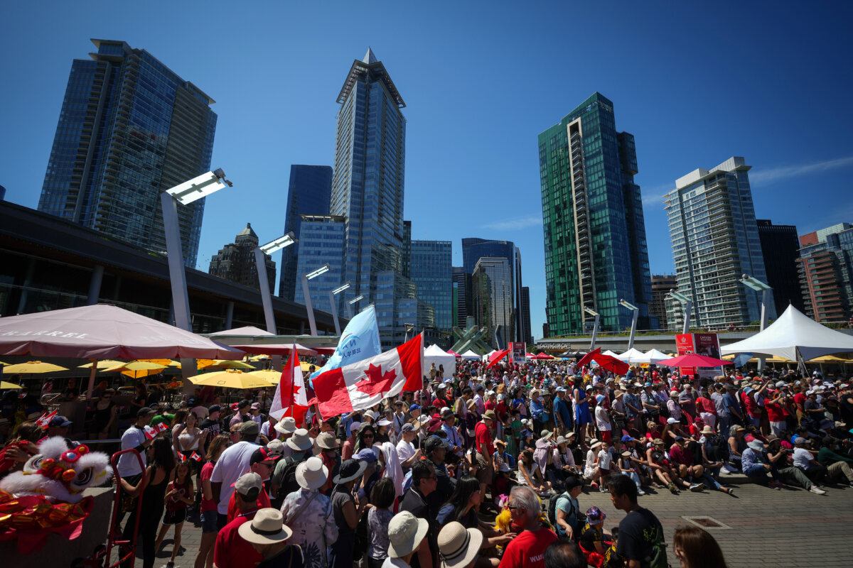 People gather for Canada Day festivities in Vancouver on July 1, 2025. (The Canadian Press/Darryl Dyck)