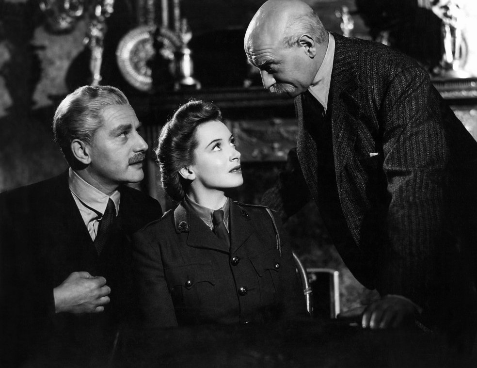 (L–R) Theo Kretschmar-Schuldorff (Anton Walbrook), Angela "Johnny" Cannon (Deborah Kerr), and Clive Wynne-Candy (Roger Livesey), in “The Life and Death of Colonel Blimp.” (General Film Distributors)