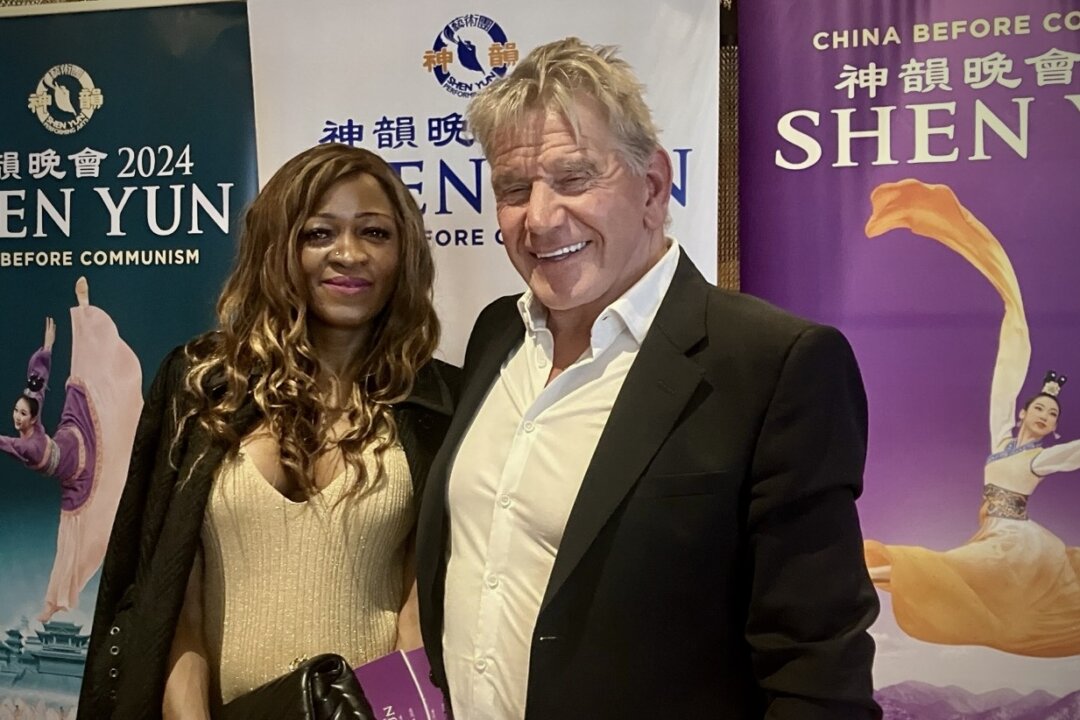 Company director Christopher Kiley and fashion designer Melody Kembani attend Shen Yun Performing Arts at the Swansea Building Society Arena in Swansea, UK on, March 24, 2026. (Say Huang/The Epoch Times)