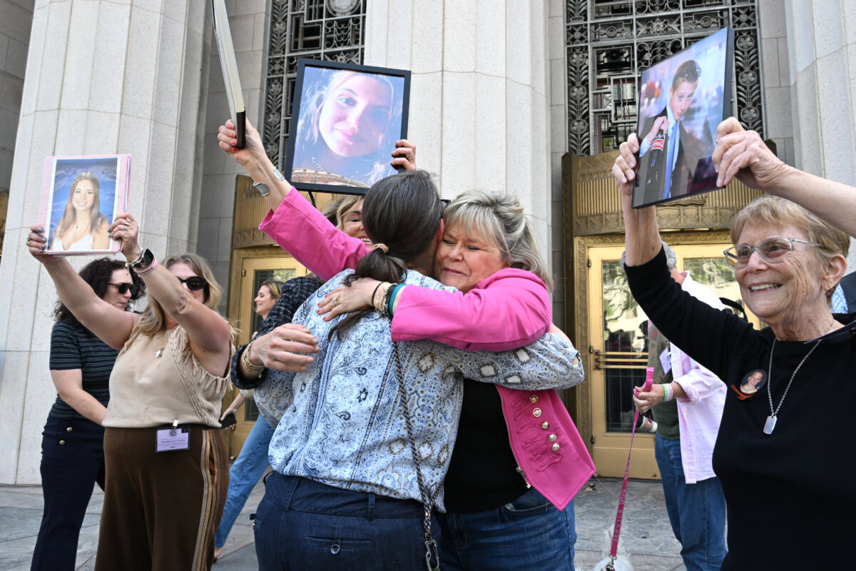 Lori Schott (center R) embraces Mary Rodee after the verdict in a landmark trial over whether social media platforms deliberately addict and harm children at Los Angeles Superior Court in Los Angeles on March 25, 2026. (William Liang/AP Photo)