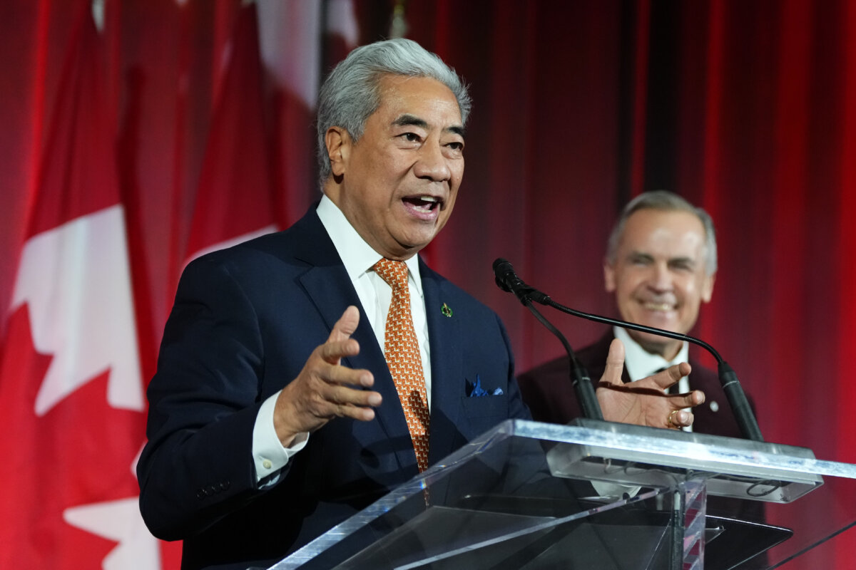 Markham-Unionville MP Michael Ma speaks alongside Prime Minister Mark Carney at the Liberal caucus holiday party in Ottawa on Dec. 11, 2025. (The Canadian Press/Justin Tang)