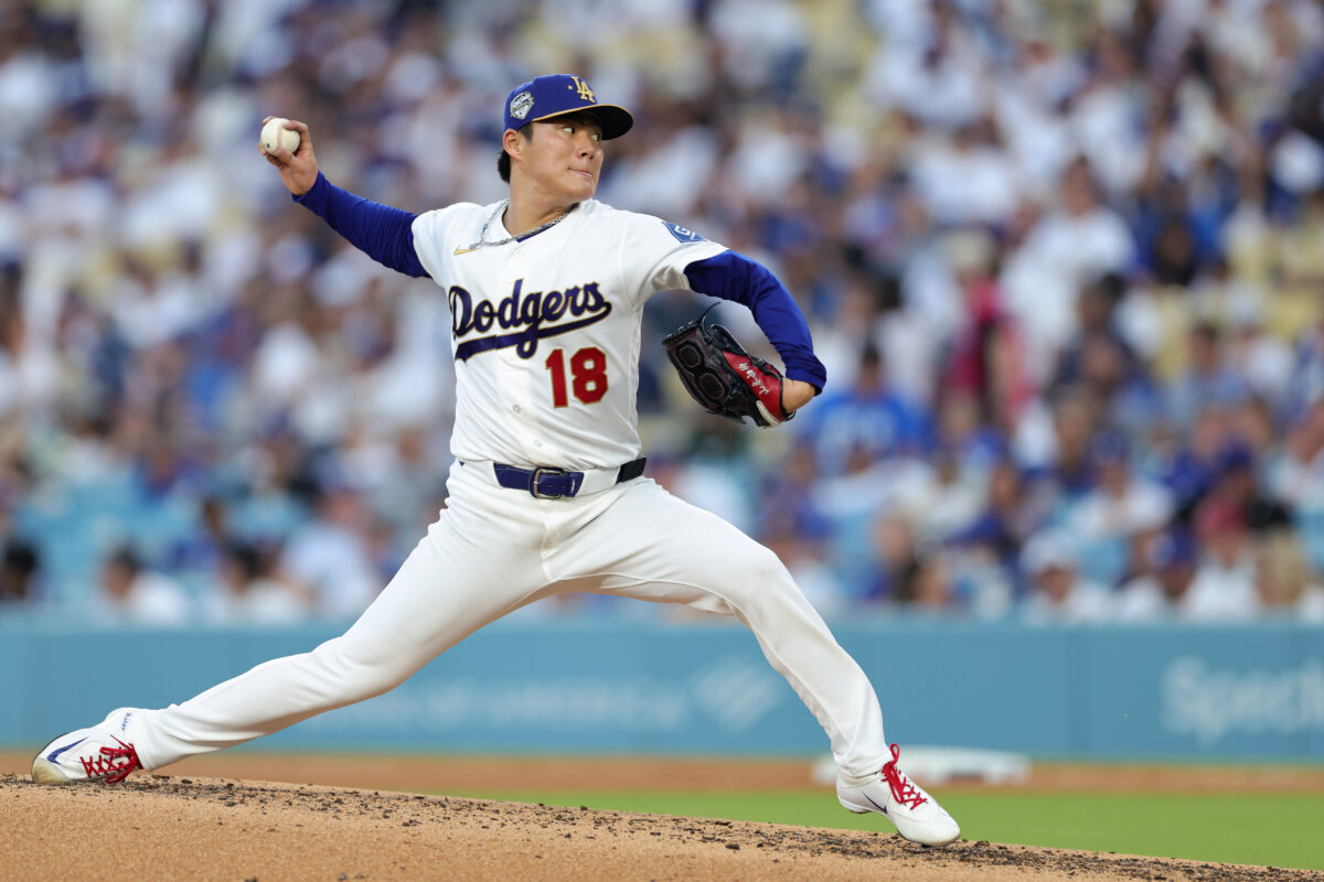 Yoshinobu Yamamoto #18 of the Los Angeles Dodgers pitches during the fifth inning against the Arizona Diamondbacks during Opening Day at Dodger Stadium in Los Angeles on March 26, 2026. (Ronald Martinez/Getty Images)