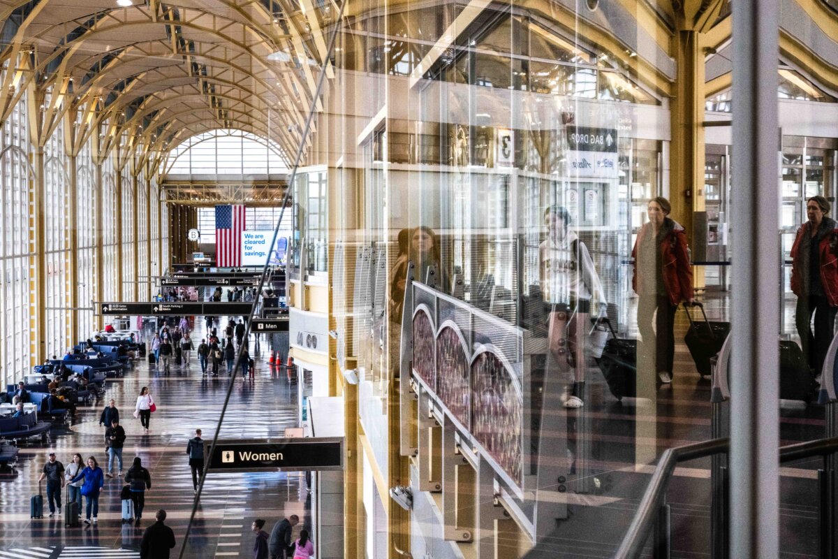 Travelers walk on the main concourse of Terminal 2 at Ronald Reagan Washington International Airport on March 30, 2026. (Roberto Schmidt/Getty Images)
