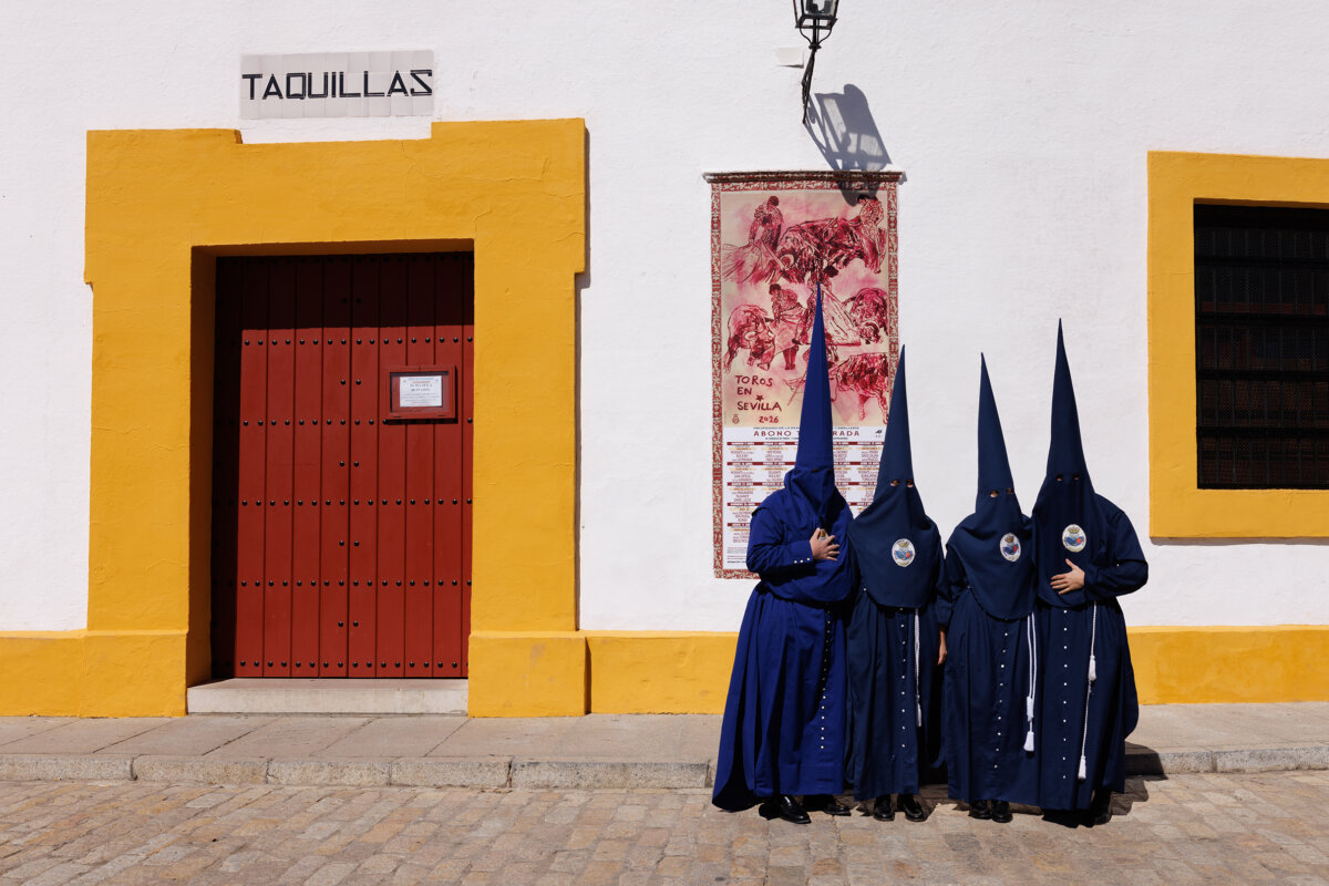 Penitents of the Roman Catholic El Baratillo Brotherhood before taking part in a Holy Week procession in Seville, Spain, on April 1, 2026. (Marcelo del Pozo/Getty Images)