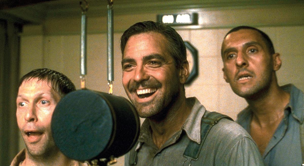 A publicity still of The Soggy Bottom Boys recording "I Am a Man of Constant Sorrow" in the 2000 film "O Brother, Where Art Thou?" (
Buena Vista Pictures /MovieStillsDB)