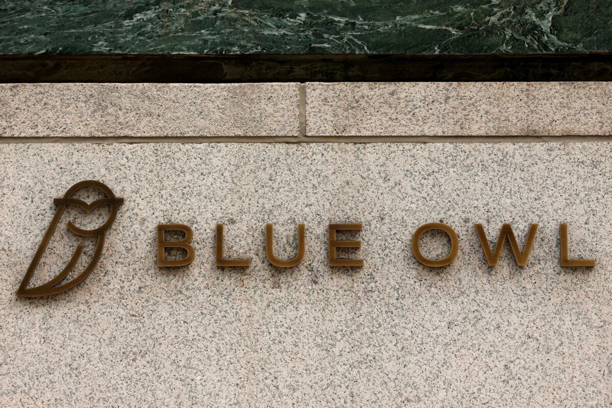 A logo for Blue Owl Capital is displayed on a midtown Manhattan office building in New York City on Feb. 24, 2026. (Brendan McDermid/Reuters)