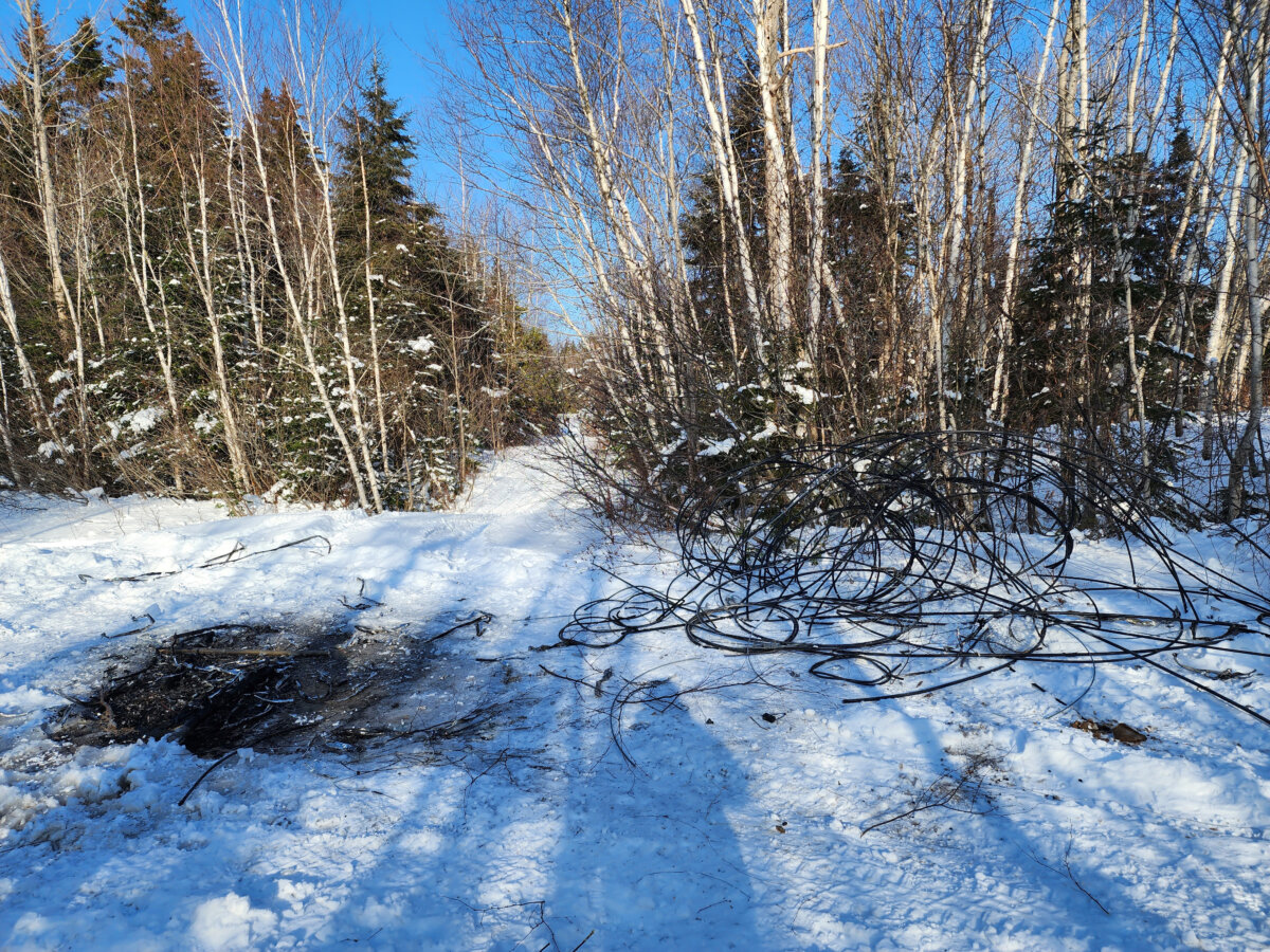 Cut Bell Canada wire is shown in this photo from Jan. 3, 2026, after thieves stole about a kilometre of wire near Clarendon, N.B. (The Canadian Press/Handout-Bell Canada)