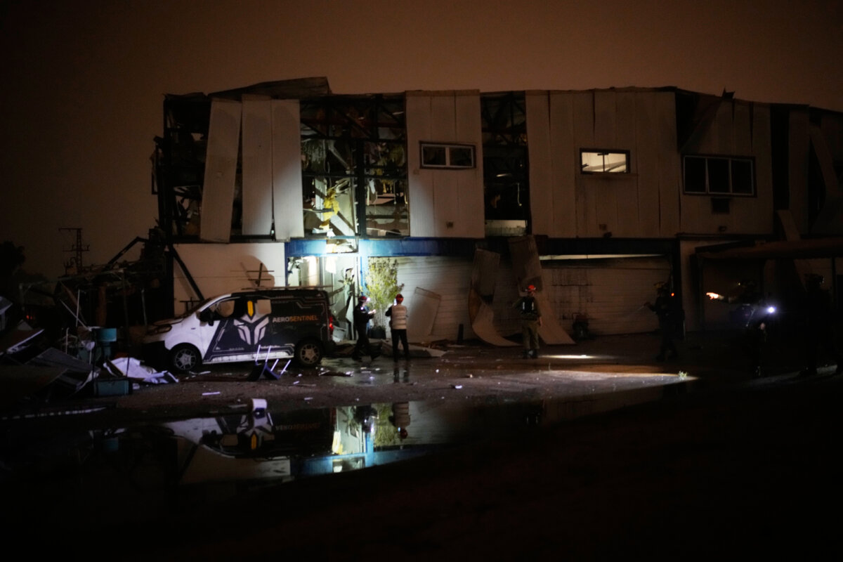 Rescue teams inspect a site hit by an Iranian missile in Petah Tikva, Israel, on April 2, 2026. (Ohad Zwigenberg/AP)