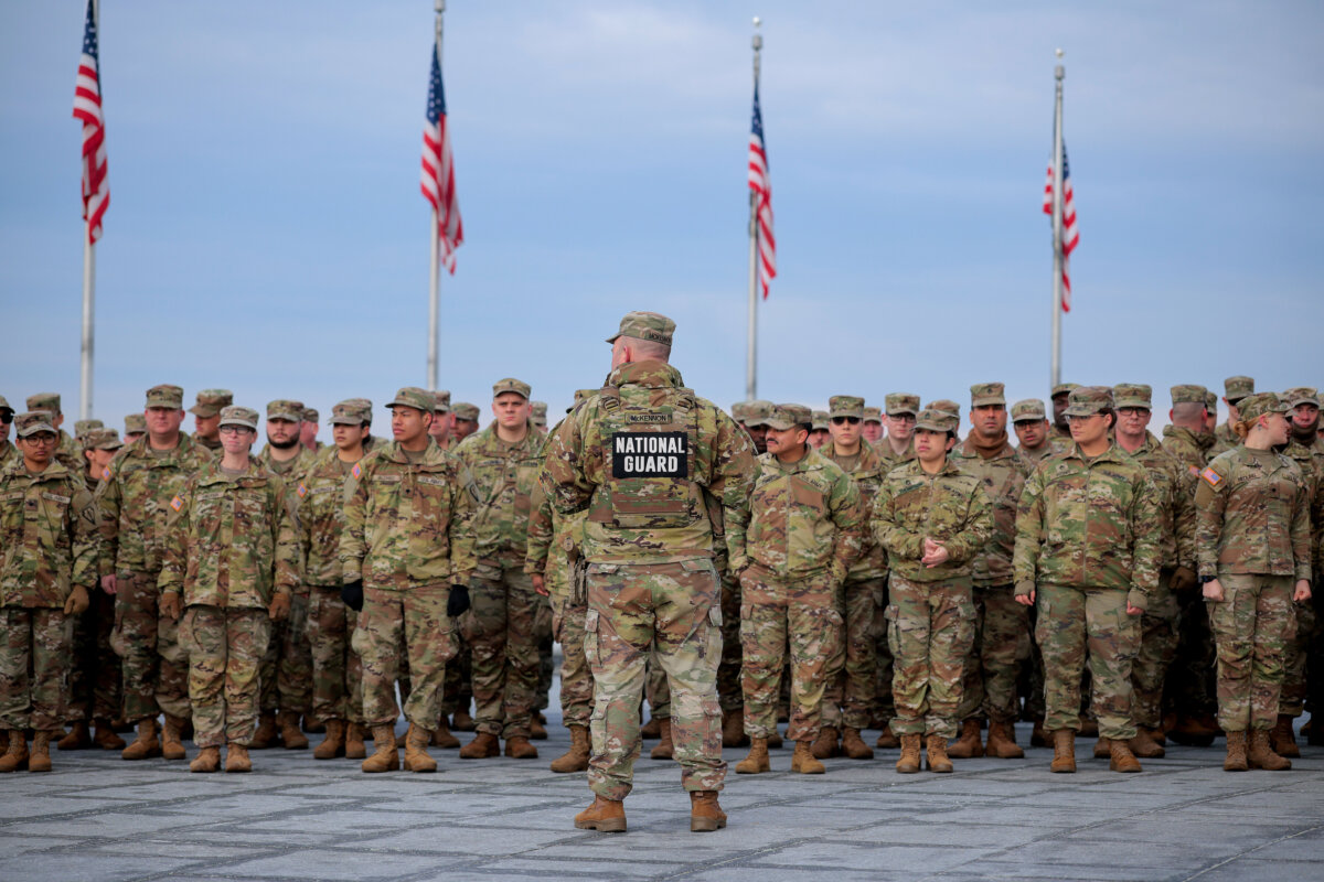 Army National Guard troops prepare for their reenlistment ceremony at the Washington Monument in Washington, on Feb. 6, 2026. (Chip Somodevilla/Getty Images)