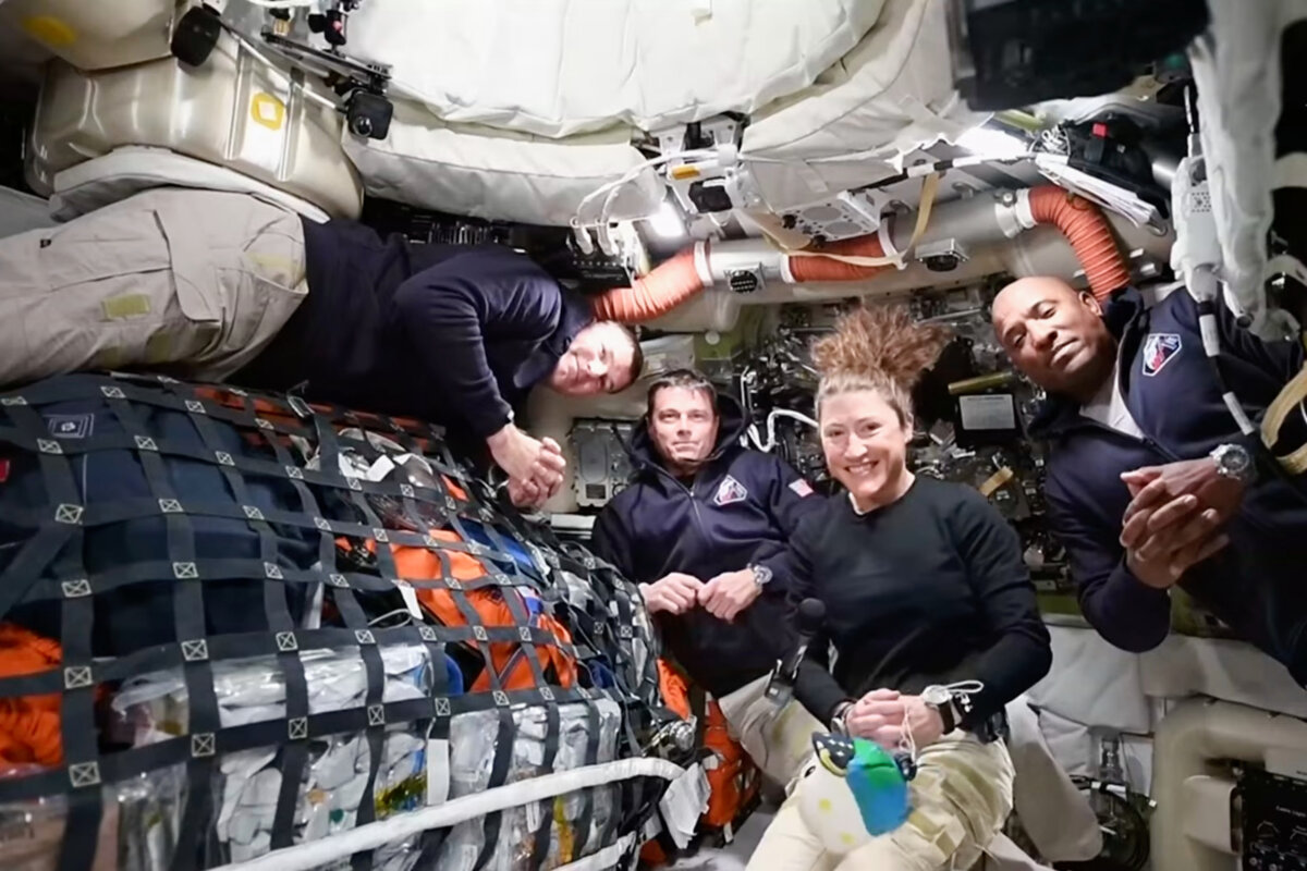 This image from video provided by NASA shows the Artemis II crew (L-R), Canadian astronaut and mission specialist Jeremy Hansen, Commander Reid Wiseman, mission specialist Christina Koch and pilot Victor Glover as they speak with NASA Mission Control in a video conference while en route to the moon, on April 2, 2026. (The Canadian Press/Handout-NASA)