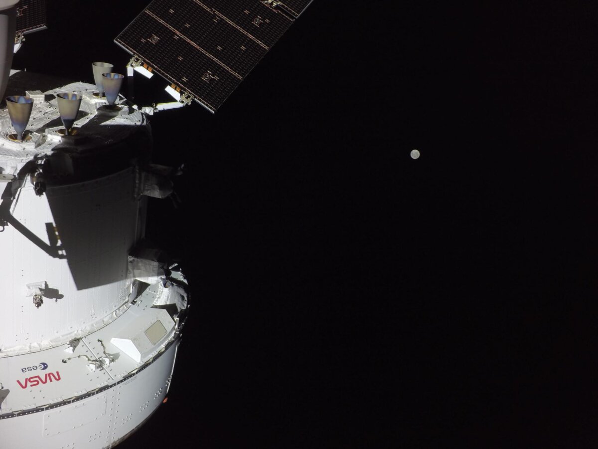 This photo shows the Orion spacecraft with the Moon in the distance, as captured by a camera on the tip of one of its solar array wings during flight day 2 of the mission.
(Courtesy of NASA).