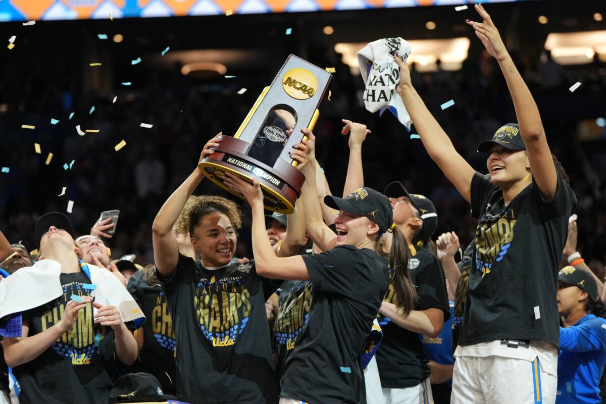 UCLA players celebrate after defeating South Carolina in the women's National Championship Final Four NCAA college basketball tournament game in Phoenix on April 5, 2026. (Rick Scuteri/AP Photo)