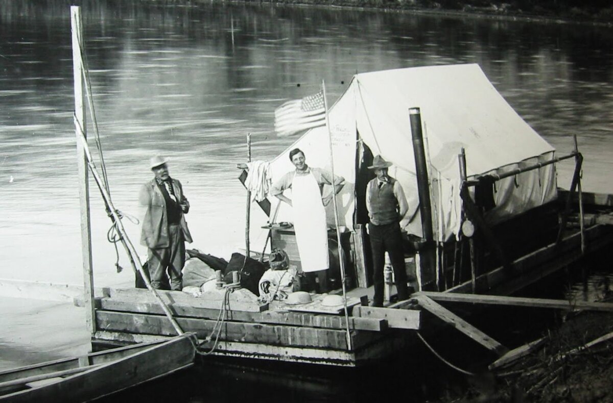 The AMNH scow Mary Jane in 1911. Left to right: The AMNH scow Mary Jane in 1911. (L–R) Henry Osborn, Fred Saunders (cook), and Barnun Brown. (Public Domain)