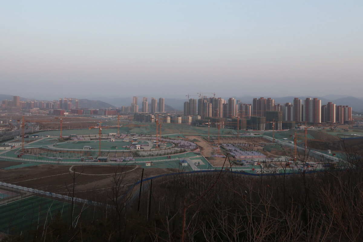 A school and residential buildings under construction are seen at Yanan New Zone, Shaanxi Province, China, on Jan. 3, 2019. (Yawen Chen/Reuters)