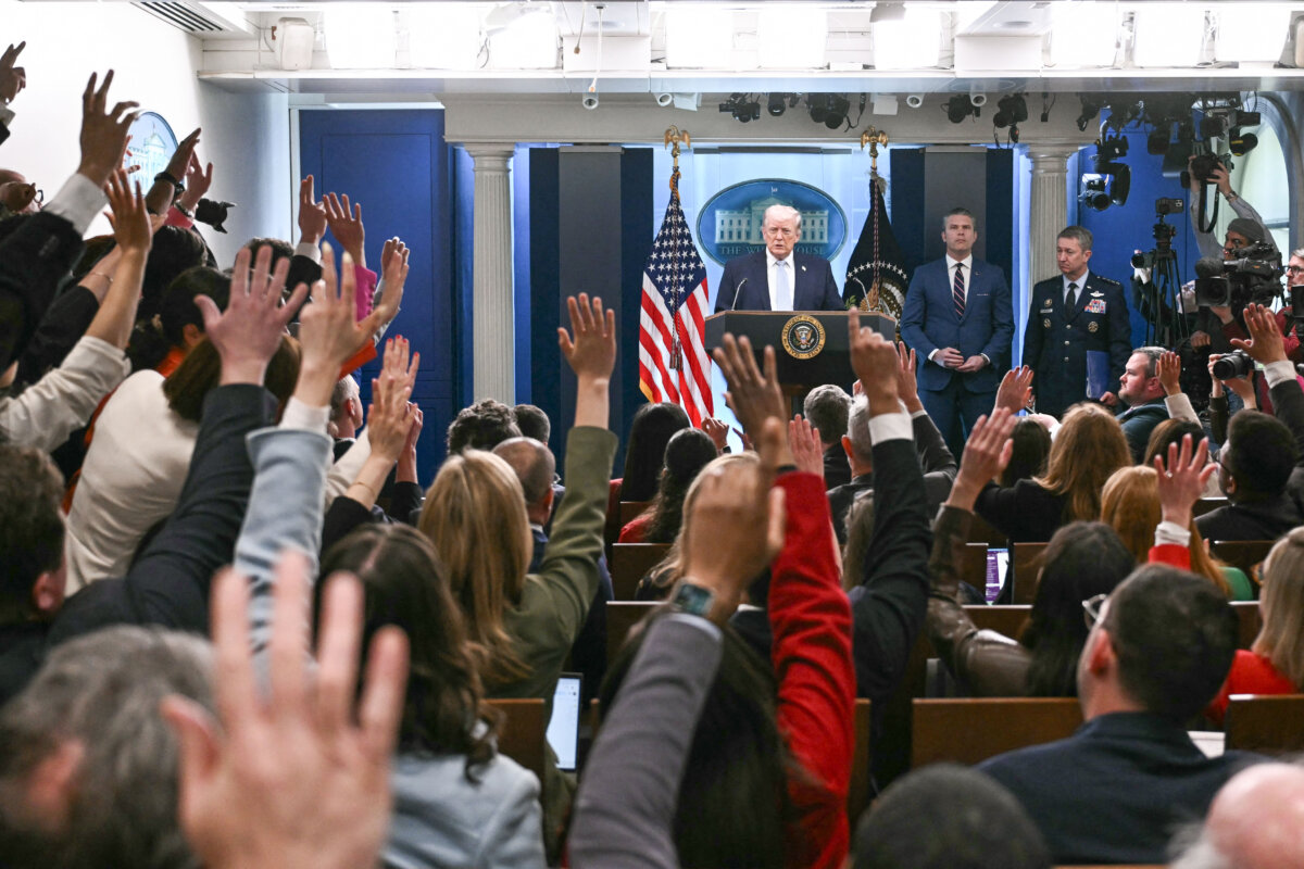 President Donald Trump, alongside Secretary of War Pete Hegseth and Chairman of the Joint Chiefs of Staff General Dan Caine, takes questions as he speaks about the conflict in Iran in the James S. Brady Press Briefing Room of the White House in Washington on April 6, 2026. (Brendan Smialowski/AFP via Getty Images)