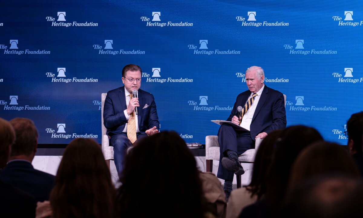 Jan Jekielek (R) and Robert Moffit discuss the Chinese communist regime's system of forced organ harvesting, at a Heritage Foundation event in Washington on April 7, 2026. (Irene Luo/The Epoch Times)