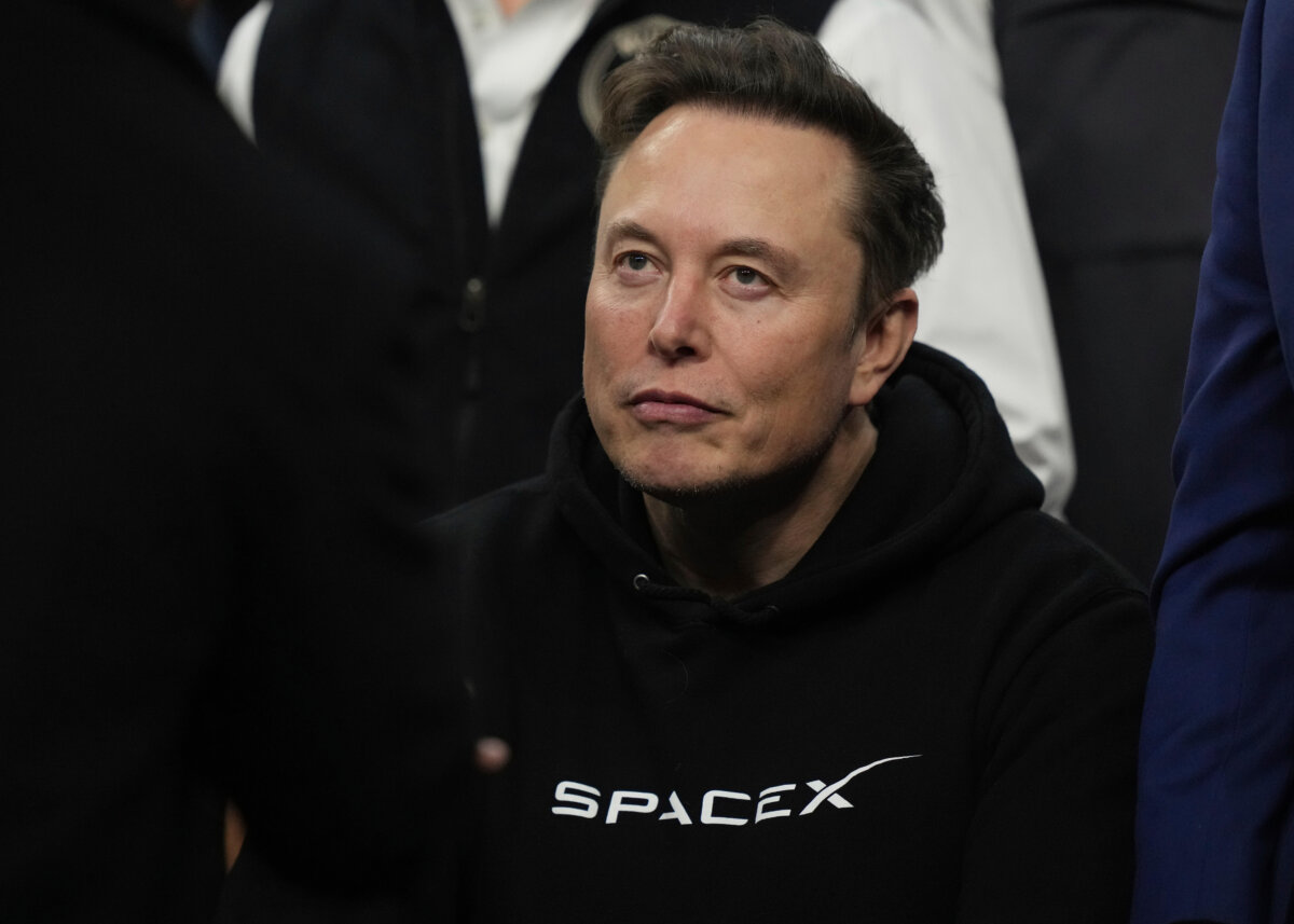 Elon Musk attends the finals for the NCAA wrestling championship in Philadelphia on March 22, 2025. (AP Photo/Matt Rourke)