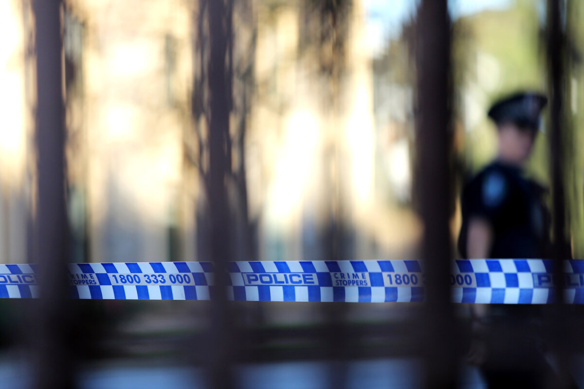 Police tape is seen at a crime scene in Adelaide, Australia, on June 5, 2014. (Daniel Kalisz/Getty Images)