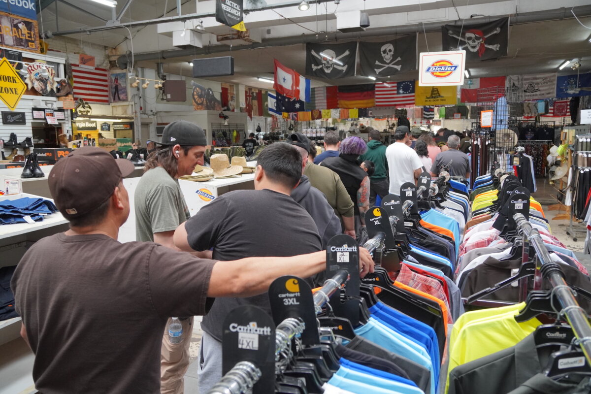 Customers line up to purchase items during a close-out sale at Miller's Surplus in Tucson, Ariz., on April 4, 2026. (Allan Stein/The Epoch Times)