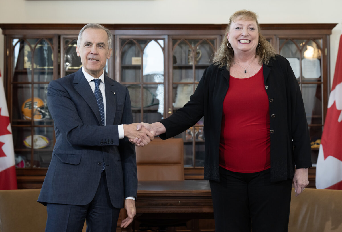Prime Minister Mark Carney shakes hands with MP for Sarnia-Lambton-Bkejwanong Marilyn Gladu in Ottawa on April 8, 2026. (Adrian Wyld/The Canadian Press)