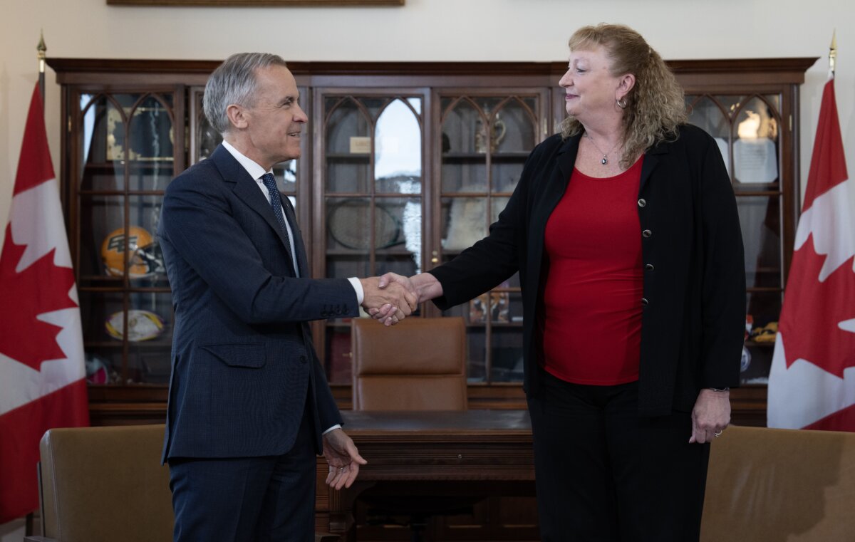 Prime Minister Mark Carney shakes hands with MP for Sarnia-Lambton-Bkejwanong Marilyn Gladu in Ottawa on April 8, 2026. (The Canadian Press/Adrian Wyld)