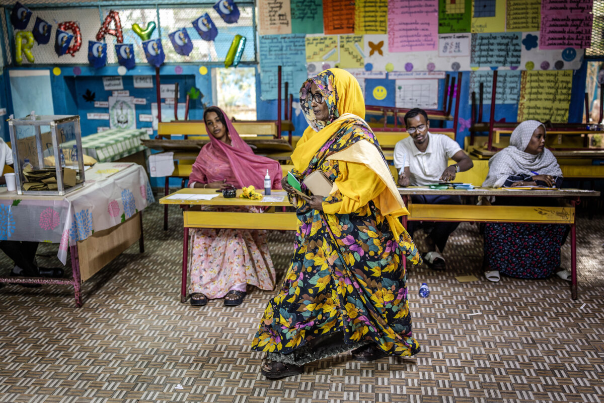 A voter proceeds to cast her ballot at a primary school serving as a polling station, during the 2026 Djiboutian presidential elections, in Djibouti, on April 10, 2026. (Luis Tato/AFP via Getty Images)